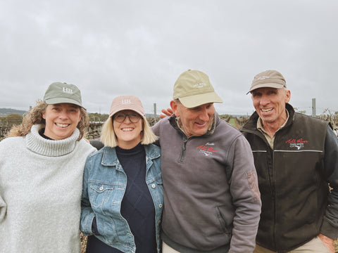 Hill River Wines Staff in vineyard wearing Hill River WInes Caps